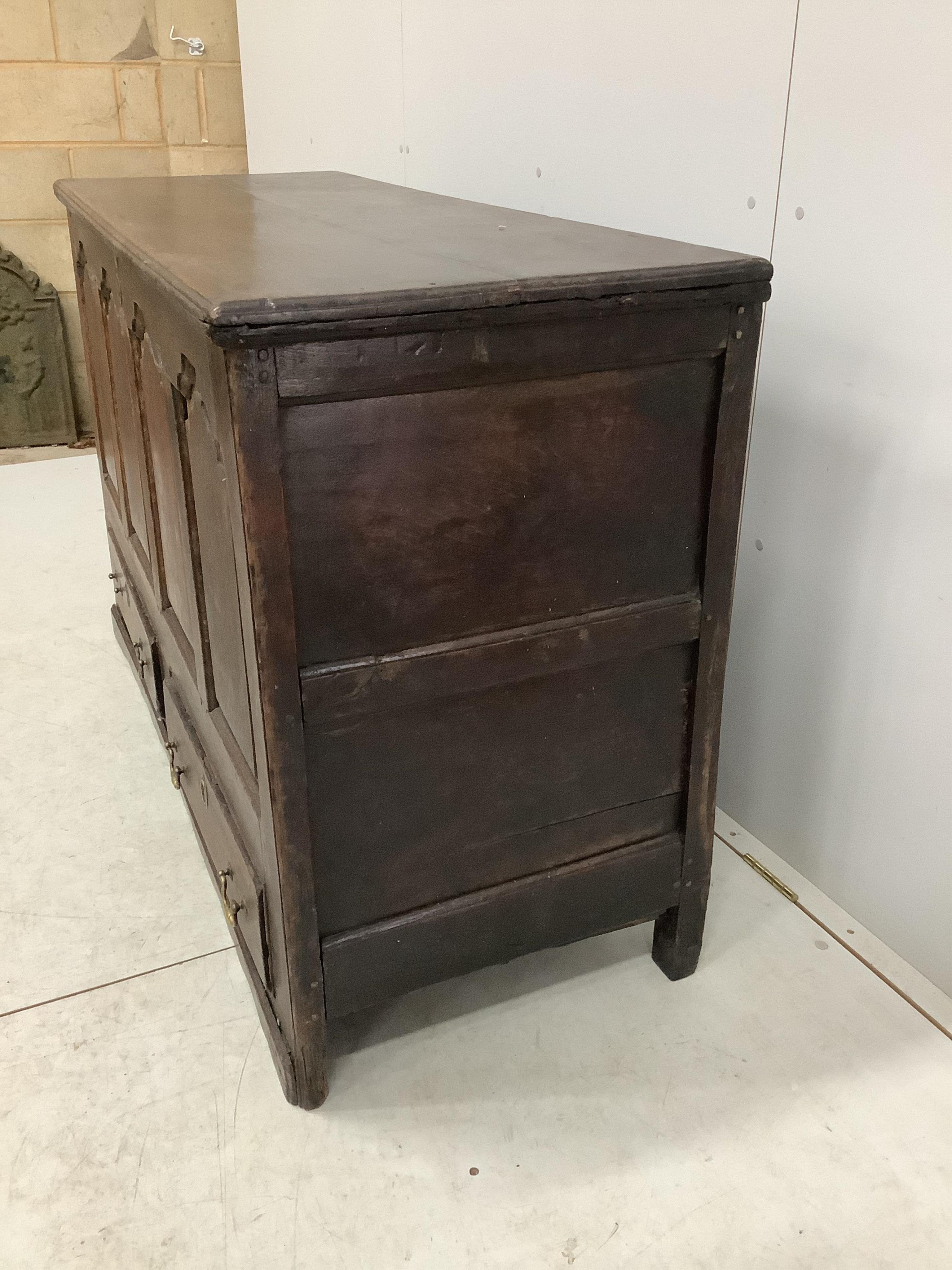 An 18th century oak mule chest, width 140cm, depth 53cm, height 88cm. Condition - fair